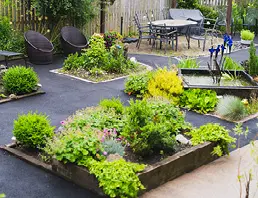 Landscaped garden with raised beds and seating at High Brake House care home, Clitheroe