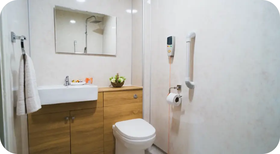Modern accessible bathroom in a Clitheroe care home with grab rails
