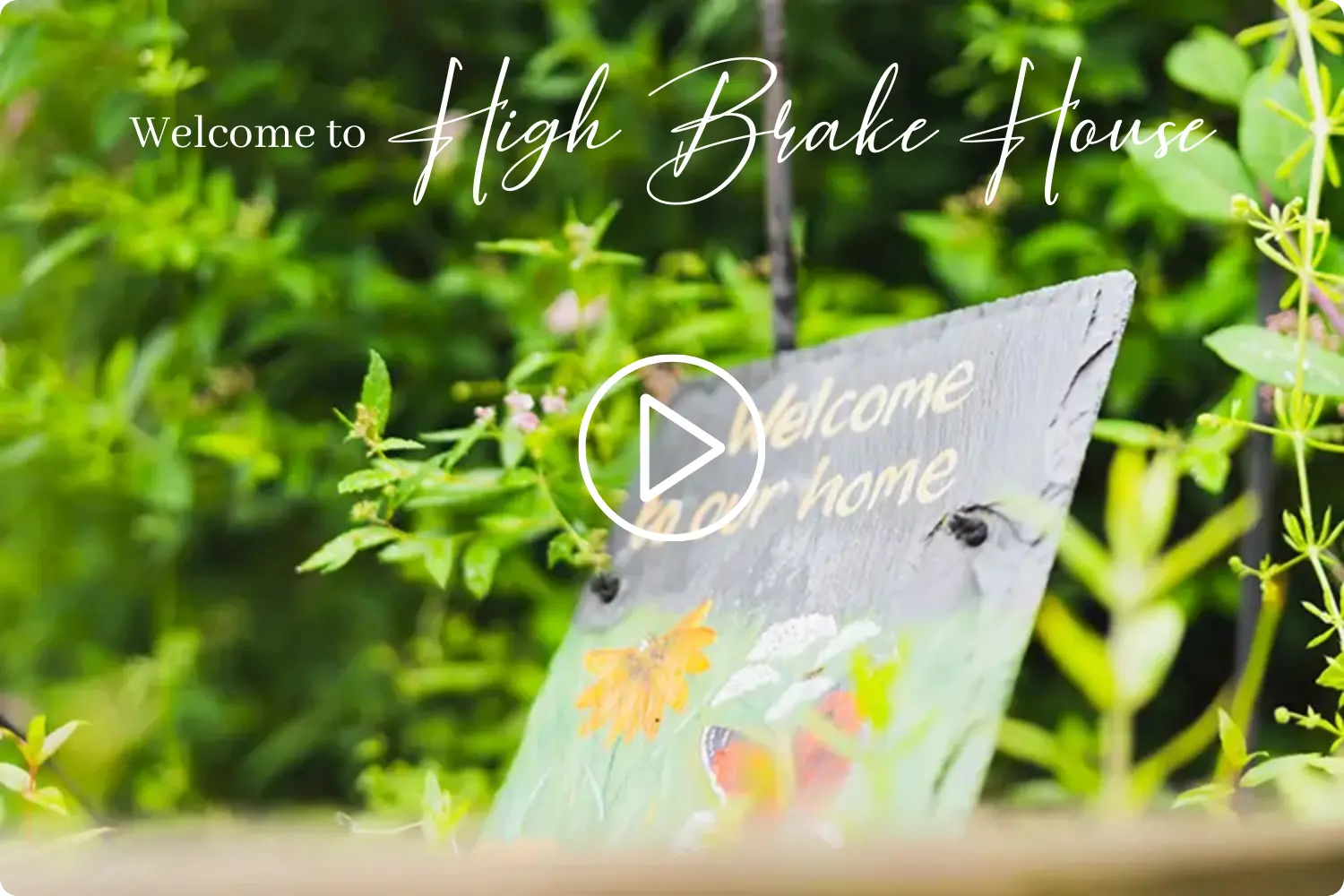 Welcome sign with flowers and butterfly at High Brake House care home, Clitheroe